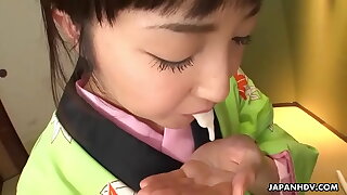 Asian bitch in a kimono sucking on his erect prick