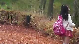 cute schoolgirl provocating  primarily the streets openair